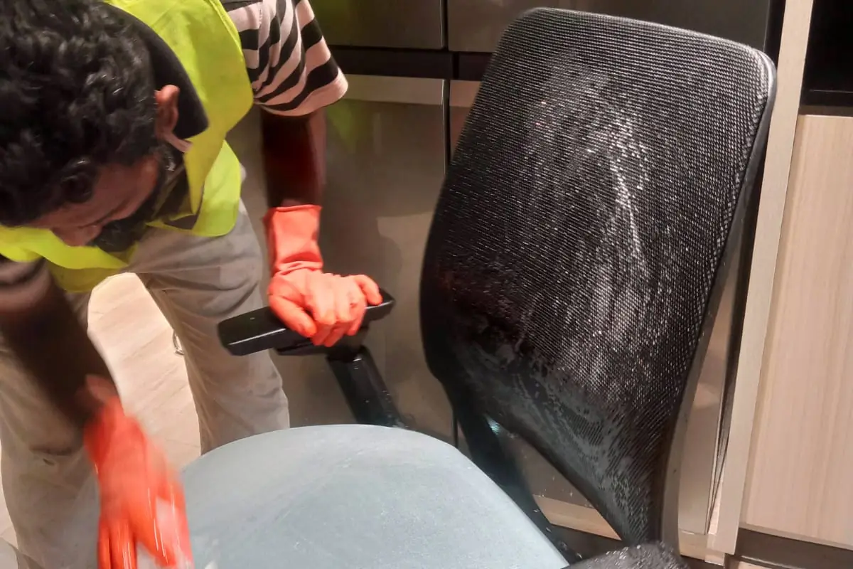 Corporate office chairs being deep cleaned by Pest Orbit housekeeping staff