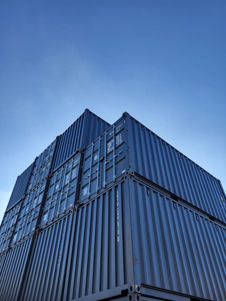 Stacked shipping containers illustrating enclosed cargo and fumigation contexts