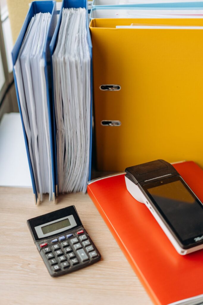 Calculator and paperwork illustrating quotation comparison