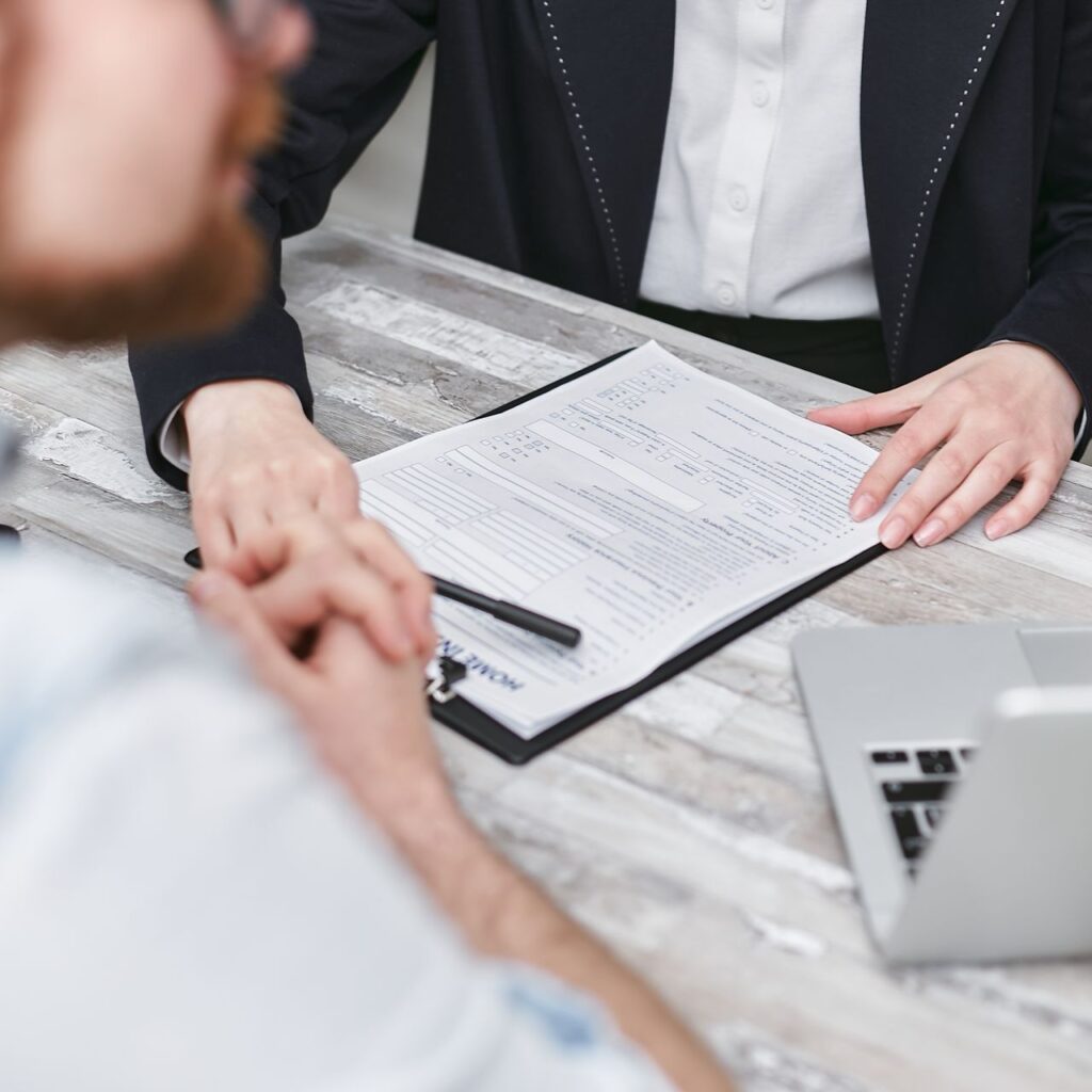 Professionals reviewing documents on a clipboard